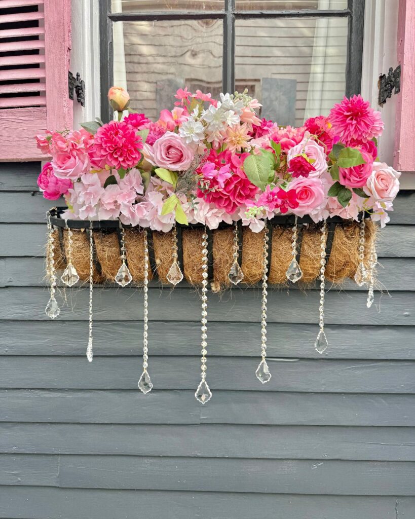 A basket of flowers on the steps outside